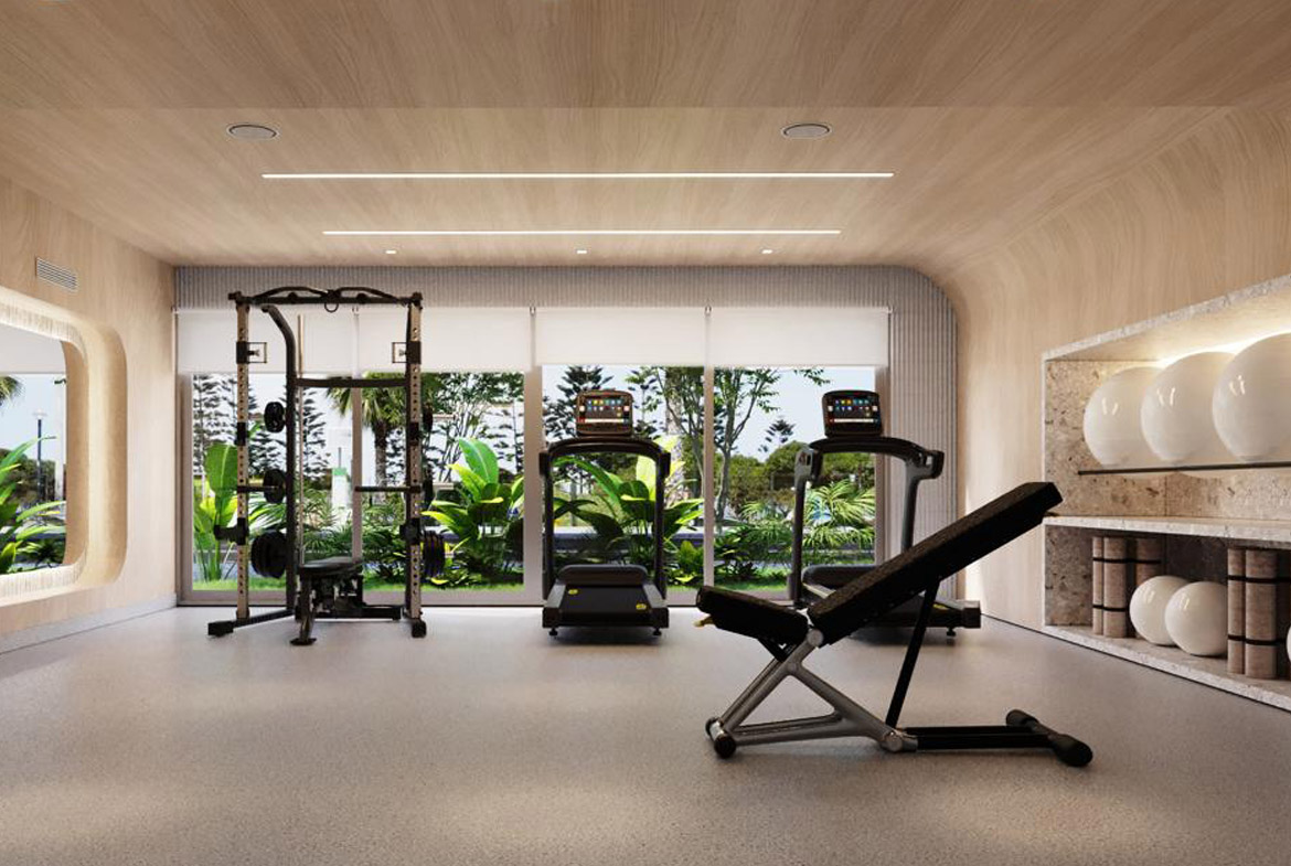 Gimnasio moderno en The Wave Miraflores con vista al mar