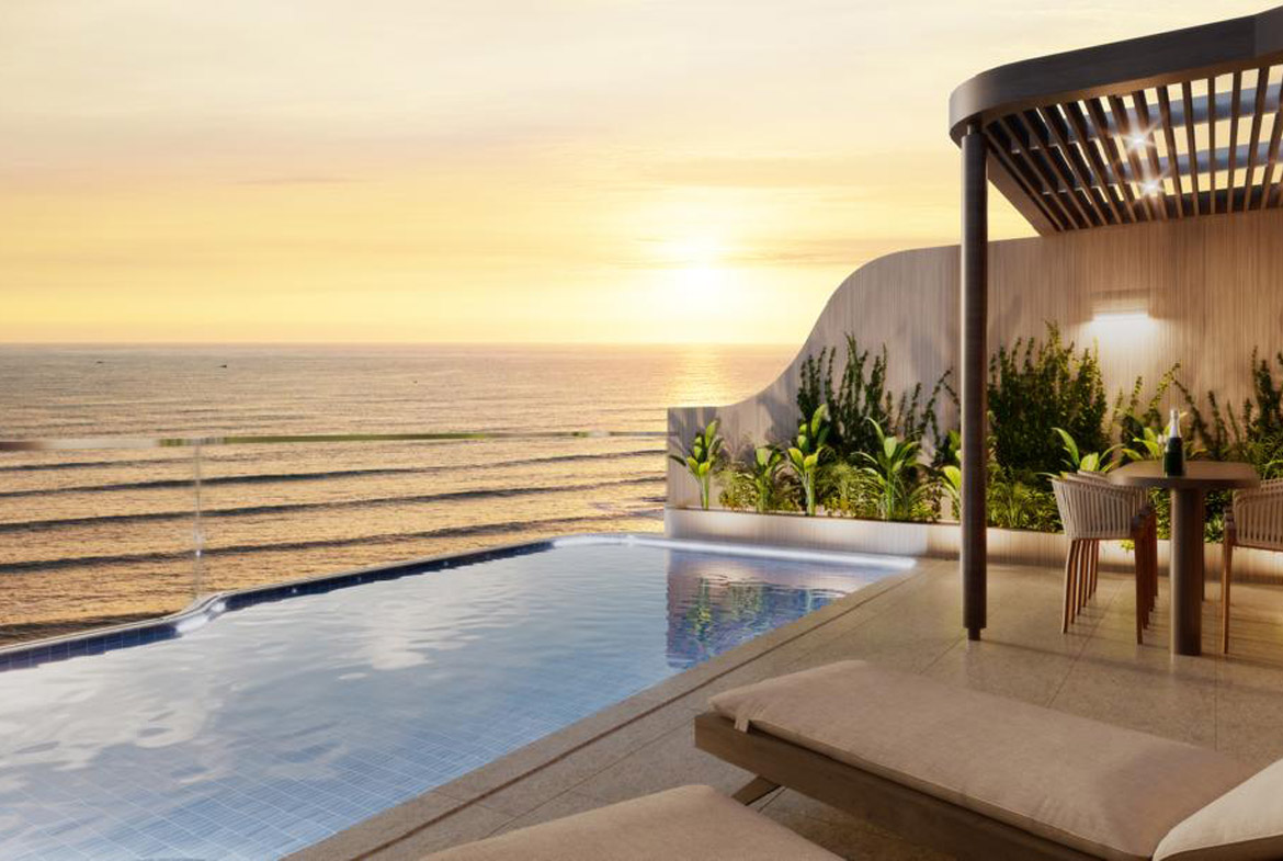 Piscina panorámica en The Wave Miraflores con vista al mar al atardecer
